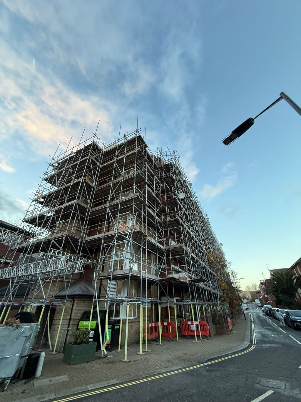 Multi-storey perimeter scaffold wrapping a residential block during re-cladding works
